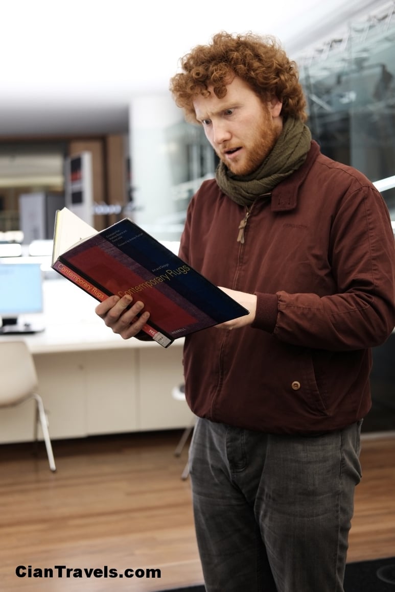 Ciaran reading Contemporary Rugs